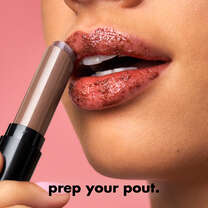 Model Applying e.l.f.'s Sugar Lip Scrub