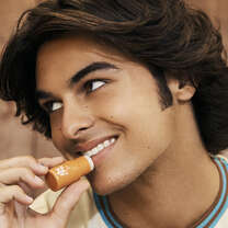 Model Applying Lip Balm