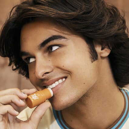 Model Applying Lip Balm