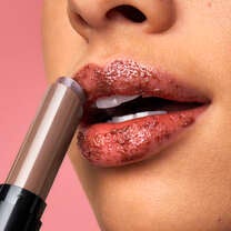 Model Applying e.l.f.'s Sugar Lip Scrub